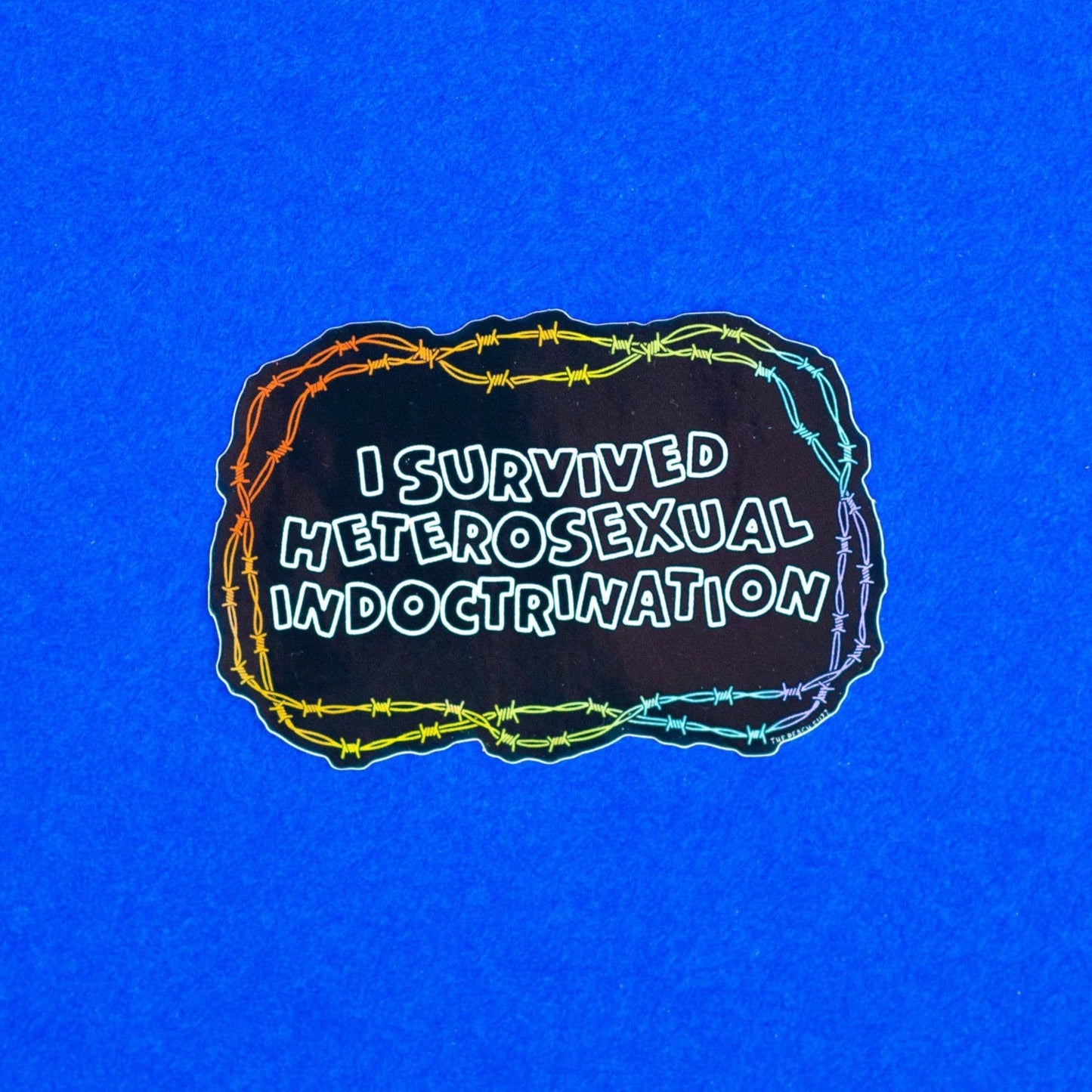 I Survived Heterosexual Indoctrination Sticker by The Peach Fuzz Co.