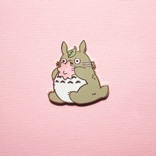 Sweet Tooth Totoro Enamel Pin over pink background